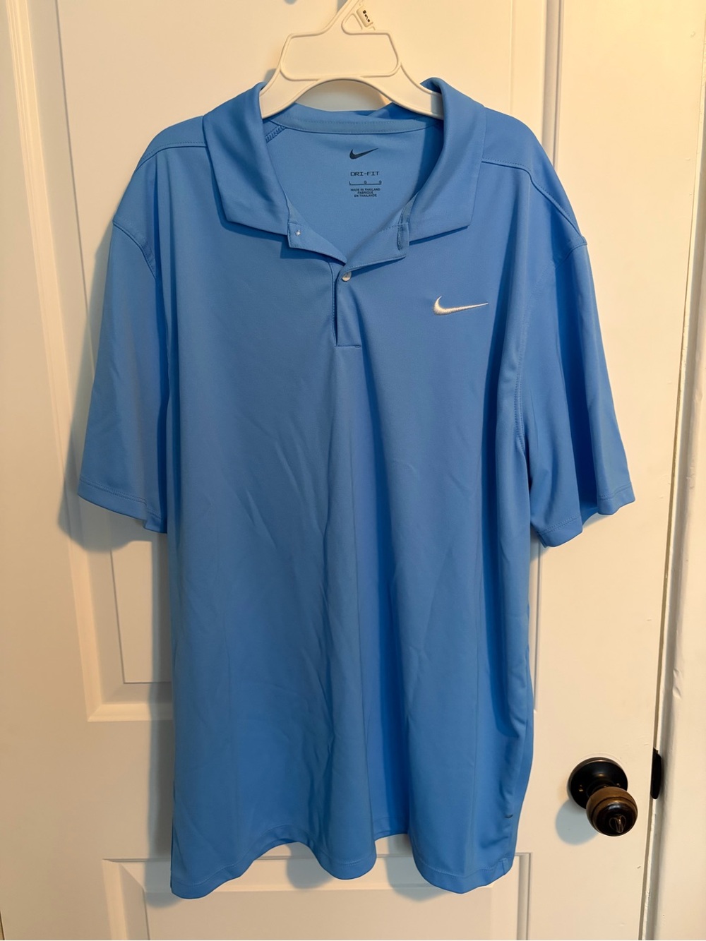 Nike Men’s Sky Blue Polo with White Swoosh